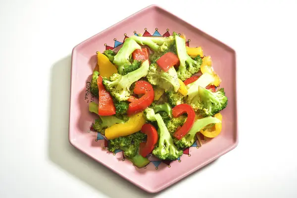 High angle shot of various vegetable on the pink plate — ストック写真