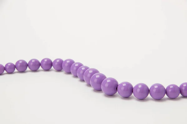 Necklace of beads on a white background — Stock Photo, Image