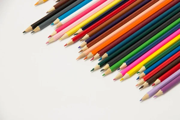 Grupp av pennor för studenter på en vit bakgrund Stockbild