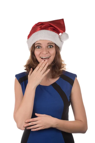 Дівчина в червоному новорічному капелюсі з різними кумедними емоціями на його ф — стокове фото