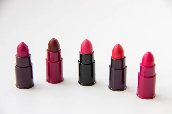 Several probes of lipsticks with red hues on a background — Stock Photo, Image