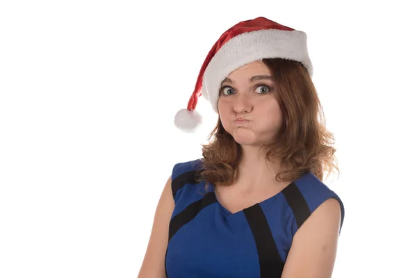 Дівчина в червоному новорічному капелюсі з різними кумедними емоціями на його ф — стокове фото