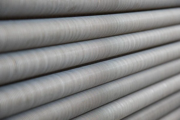 Abstract background of metallic long pipes with thread — Stock Photo, Image