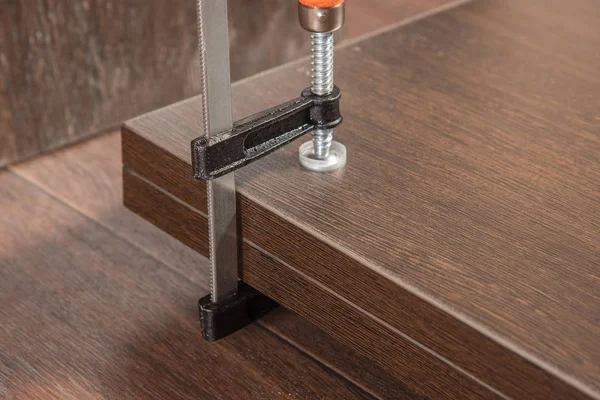 Assembling a wooden cabinet at home using a drill and a screwdri — Stock Photo, Image