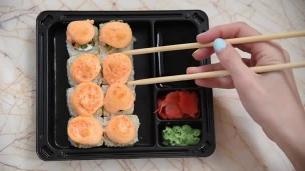 People Eat Japanese Food Tasty Rolls Taken Wooden Sticks Dipped — Stock Video