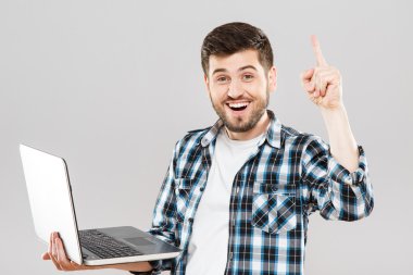 Young man with laptop has idea