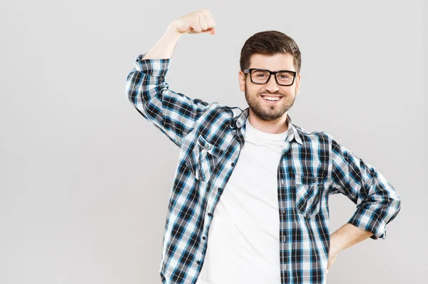 Young man showing strength — Stock Photo, Image
