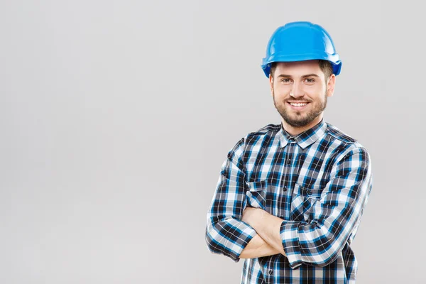 Giovane in casco blu da costruzione — Foto Stock