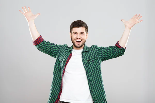 Young man in green checked t-shirt has an idea — Zdjęcie stockowe