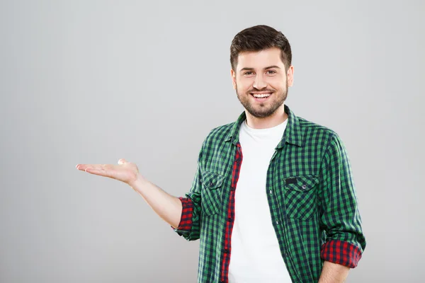 Young man in green checked shirt — Stockfoto