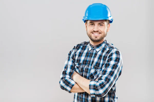 Uomo in casco blu da costruzione — Foto Stock