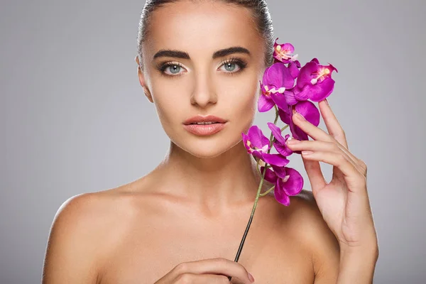model with purple orchid