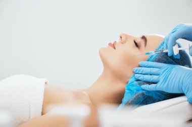 woman  lying  in cosmetological clinic clipart