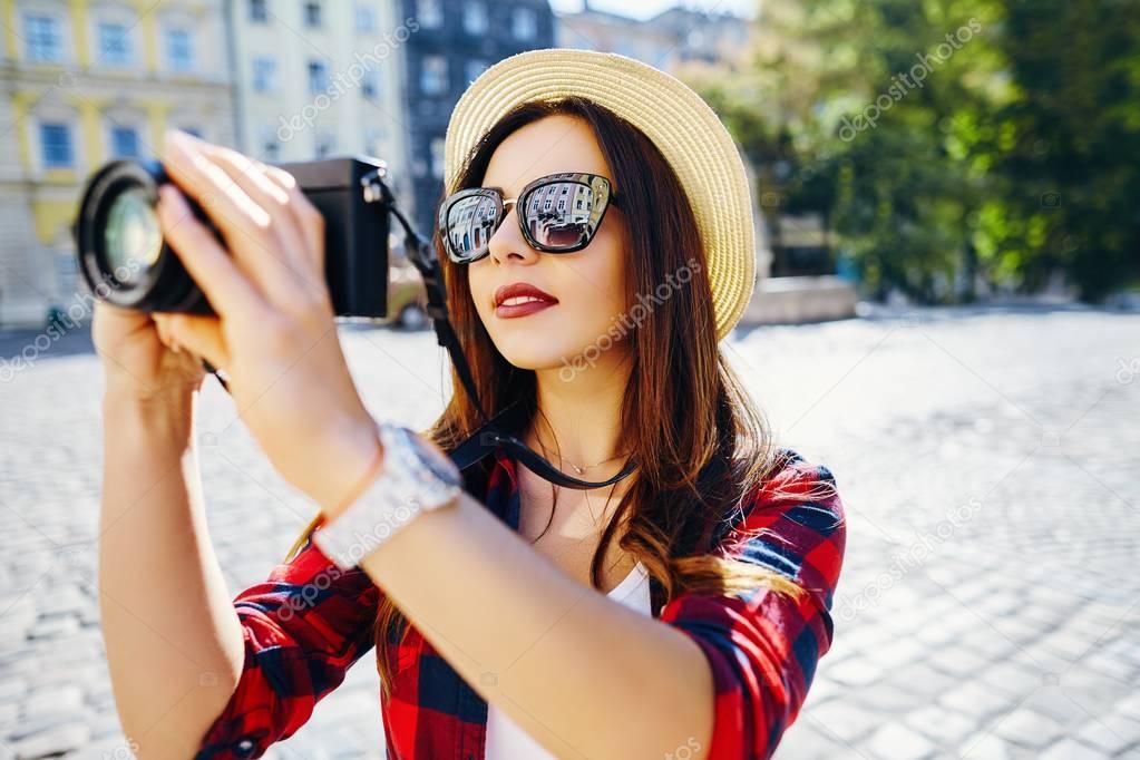 tourist making photo with camera