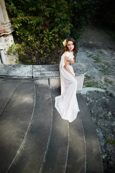 bride with  curly hair in wedding dress