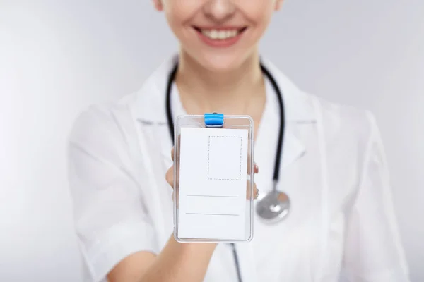 Doctor holding personal medical card — Stock Photo, Image