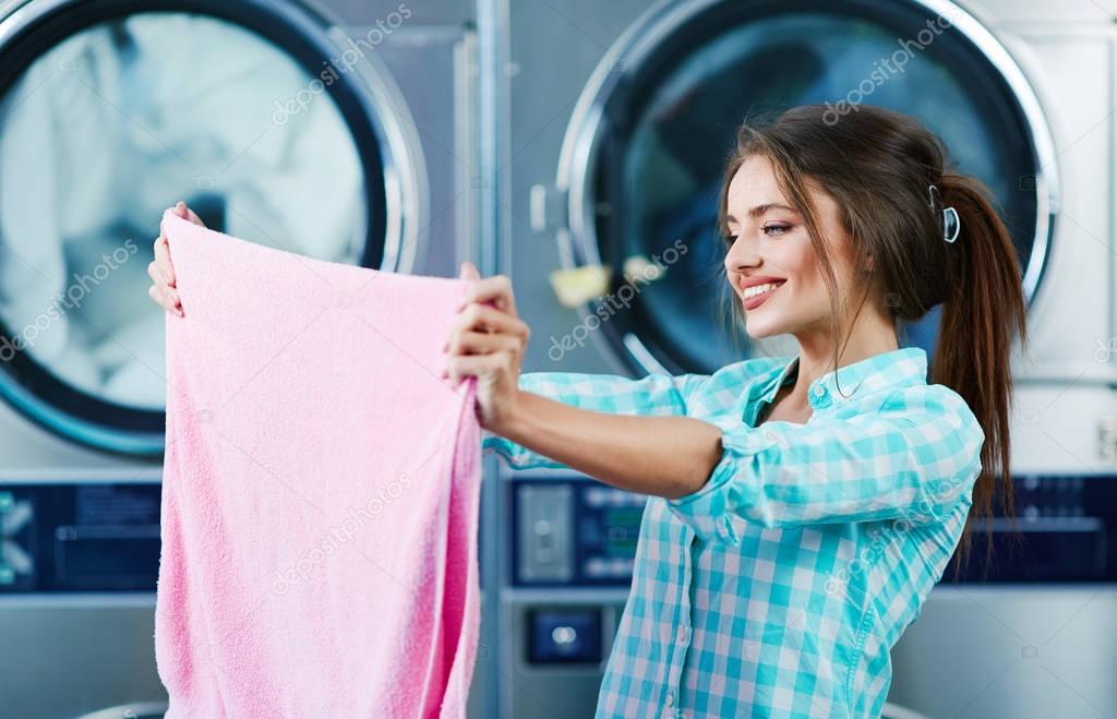 Woman holding clean colorful  towel