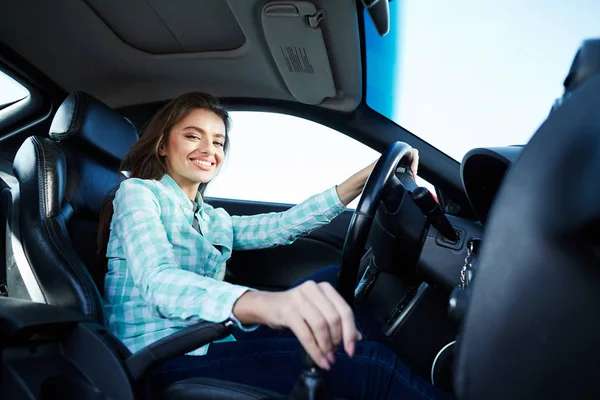 Exited woman in new automobile Royalty Free Stock Images