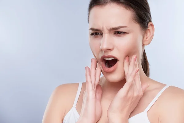 Woman suffering from toothache