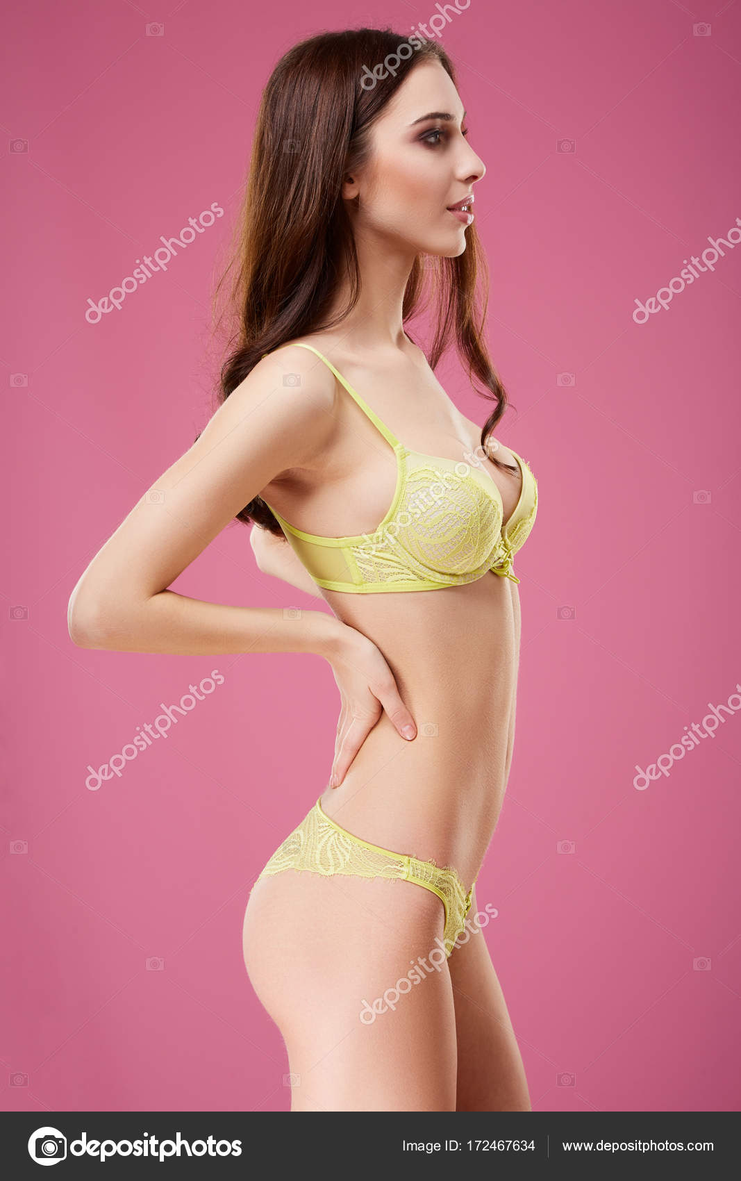 Attractive girl wearing yellow underwear Stock Photo by