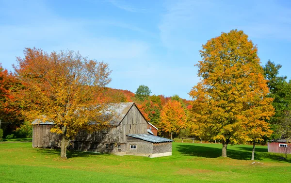 Farm and mountain landscape at autumn season