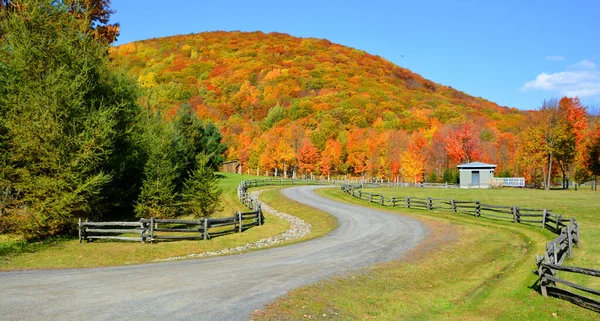 Farm and mountain landscape at autumn season