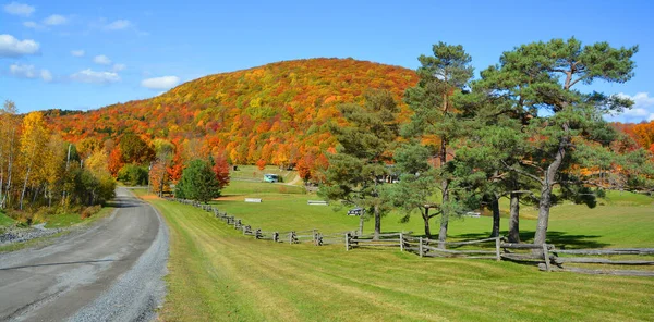 Farm and mountain landscape at autumn season