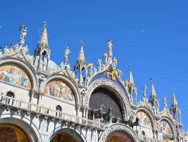 St Mark's Basilica in Venice, Italy. This basilica is one of the main tourist attractions of Venice. Famous historical architecture in Venice. The travel across Venice and sightseeing in summer.