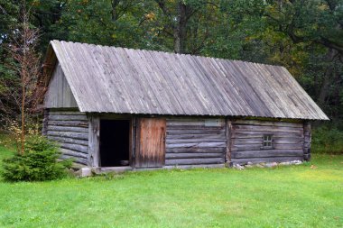 PUHALEPA PARISH HIIUMAA ESTONIA 09 19 2015: Old cottage-cum threshing barnon island of Hiimaa, Estonia.The old medieval village and huts