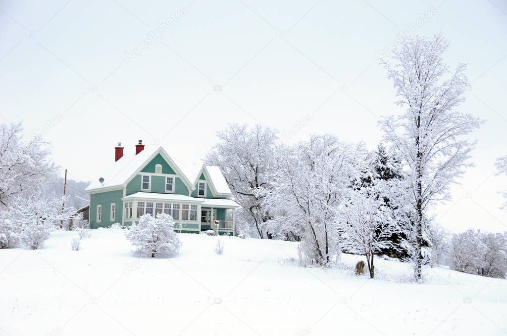 House in rural Quebec Canada in a snow storm.