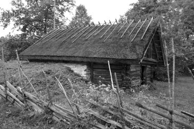 PUHALEPA PARISH HIIUMAA ESTONIA 09 19 2015: Old cottage-cum threshing barnon island of Hiimaa, Estonia.The old medieval village and huts
