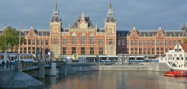 AMSTERDAM NETHERLAND OCTOBER 03 2015 Station Amsterdam Centraal is the largest railway station of Amsterdam, Netherlands, and a major national railway hub. Used by 260,000 passengers a day.