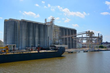 SAVANNAH GEORGIA USA JUNE 27 2016:  Port of Savannah is a major U. S. seaport. Its facilities for oceangoing vessels line both sides of the Savannah River 18 miles (29 km) from the Atlantic Ocean