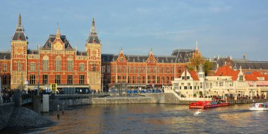 AMSTERDAM NETHERLAND OCTOBER 03 2015 Station Amsterdam Centraal is the largest railway station of Amsterdam, Netherlands, and a major national railway hub. Used by 260,000 passengers a day.