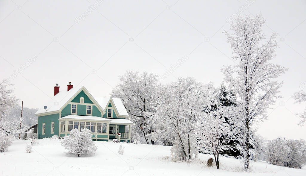 House in rural Quebec Canada in a snow storm.