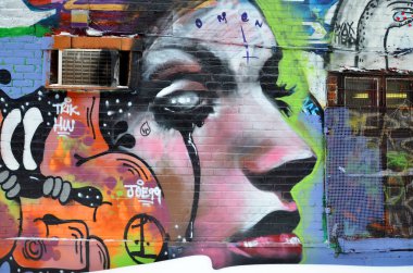 MONTREAL CANADA MARCH 30: Street art Montreal on march 30 2014 in Montreal Canada. Montreal. is the perfect place to walk in the back alleys and abandoned areas, looking for fresh air and street art.