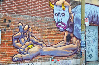 MONTREAL CANADA MARCH 30: Street art Montreal on march 30 2014 in Montreal Canada. Montreal. is the perfect place to walk in the back alleys and abandoned areas, looking for fresh air and street art. 