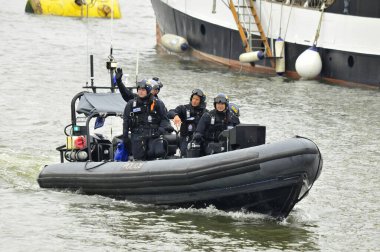 LONDON, UK - JUNE 1: Police boats watching on Thames river during the Queen's Diamond Jubilee celebrations on June 1, 2012 in London England, UK clipart