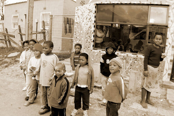 KHAYELITSHA, CAPE TOWN - MAY 22: A unidentified group of young children play on a street of Khayelitsha township, on May 22, 2007, Cape Town, South Africa Khayelitsha is township in Western Cape, SA * * Note: Slight blurriness, best at smaller sizes