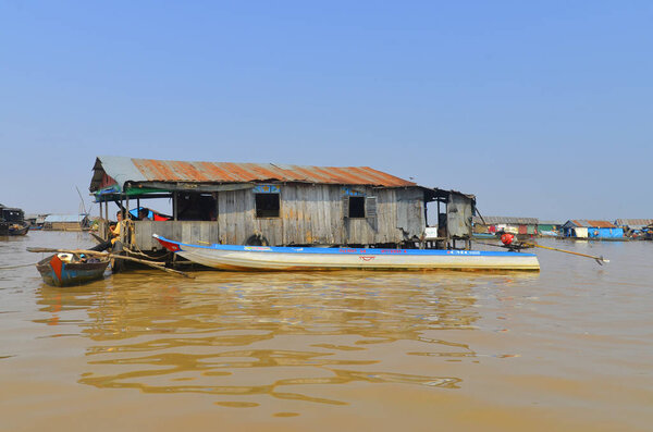 TONLE SAP CAMBODIA LAKE - MARCH 31: Floating house along the Tonle sap River is a combined lake and river system of major importance to Cambodia on march 31 2013 in Tonle Sap Lake Cambodia.  