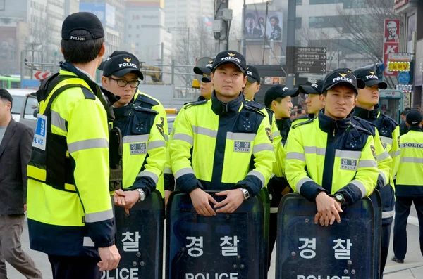 SEOUL, SOUTH KOREA - APRIL 6: Seoul riot police during protestation again redundancy people by a company on april 6 2013 in Seoul South Korea