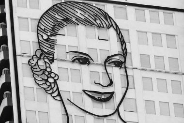 BUENOS AIRES ARGENTINA - NOV. 26: On north facade of the Social Development Ministry in Buenos Aires decorated with a 10-storey high portrait of Evita Peron on 11 26 2011 in Buenos Aires, Argentina  clipart