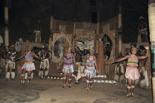 SAKALAND - NOVEMBER 27 : Unidentified Zulu dancers wear traditional Zulu clothing, during presentation of a Zulu show on November 27, 2010 Shakaland Zulu Cultural Village, KwaZulu-Natal, South Africa
