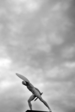 BERLIN GERMANY - MAY 12 2010: Statue of a Greek man with shield and sword at the gates of the Schloss Charlottenburg or Charlottenburg Palace, built by Johann Arnold Nering in Baroque and Rococo style