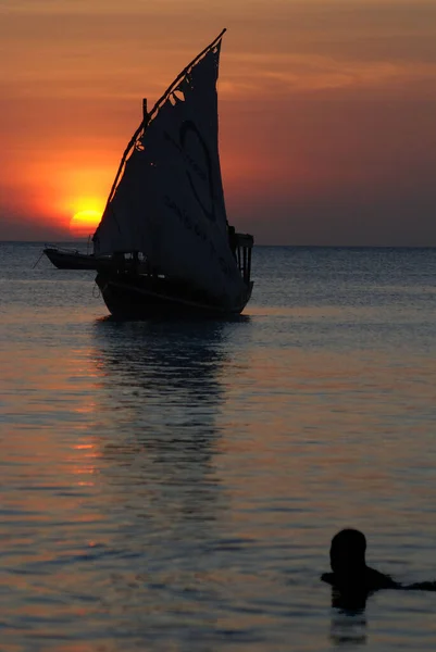 NUNGWI BEACH ZANZIBAR TANZANIA - 23 11 2011: Fisherman Boat at sunset, Taken at Nungwi Village, Zanzibar Island, Tanzania Nungwi. Nungwi is traditionally the centre of Zanzibar's dhow-building industry.