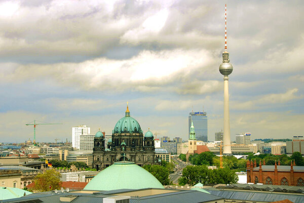 BERLIN GERMANY - 09 24 17: Berlin Cathedral is the short name for the Evangelical Supreme Parish & Fernsehturm (Television Tower) located at Alexanderplatz.