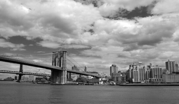 NY, NY, USA - MAY 22 The Brooklyn Bridge is one of the oldest suspension bridges in the United States. Completed in 1883, it connects the New York City boroughs of Manhattan and Brooklyn by spanning the East River on May 22, 2010 NY' NY, USA