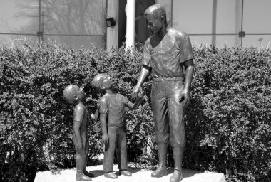 MONTREAL CANADA - MAY 5: Bronze statue of Jackie Robinson American baseball player who became the first African American to play in Major League Baseball (MLB). On may 5 2013 in Montreal Canada clipart