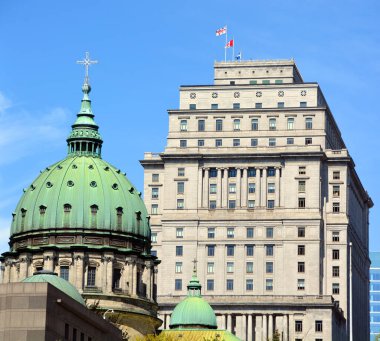 MONTREAL QUEBEC CANADA - 05 20 2019: Downtown Montreal , Sunlife building Cathedral-Basilica of Mary, Queen of the World