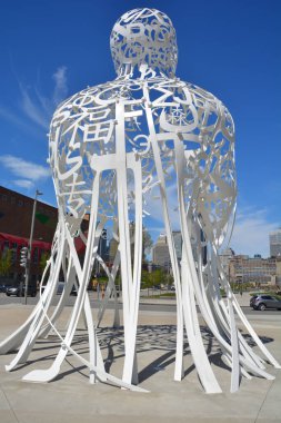 MONTREAL CANADA - 05 20 2020: Source a stainless-steel sculpture consists of a random intertwining of letters taken from Latin, Greek, Chinese, Arab, Cyrillic, Hindi, Hebrew, and Japanese alphabets